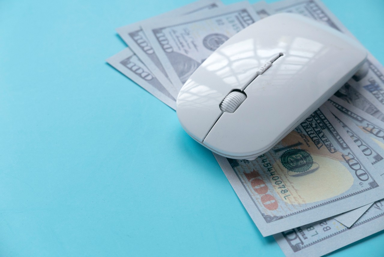 image of a computer mouse and money