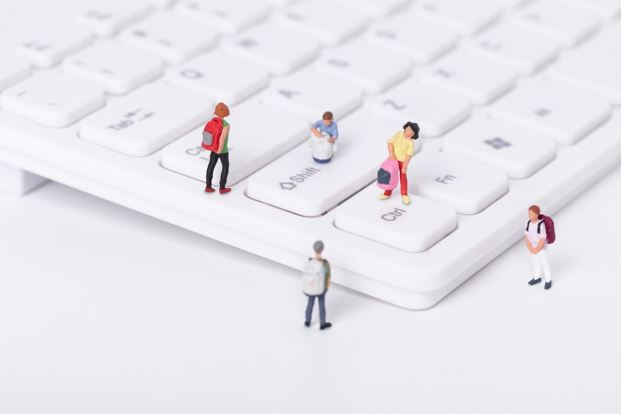 image of keyboard with miniature people