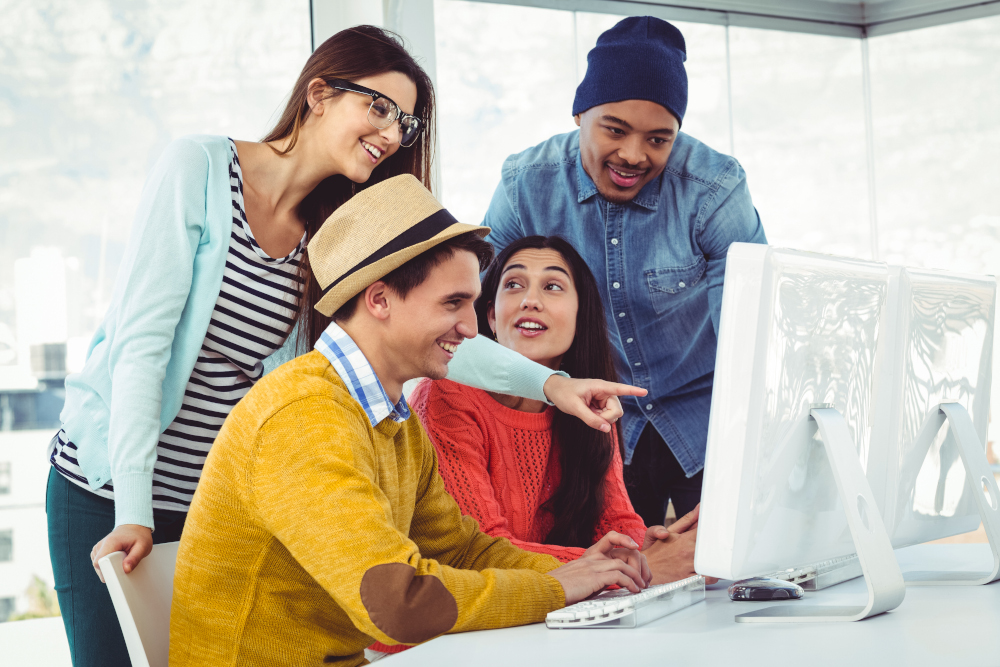 image of people looking at a computer