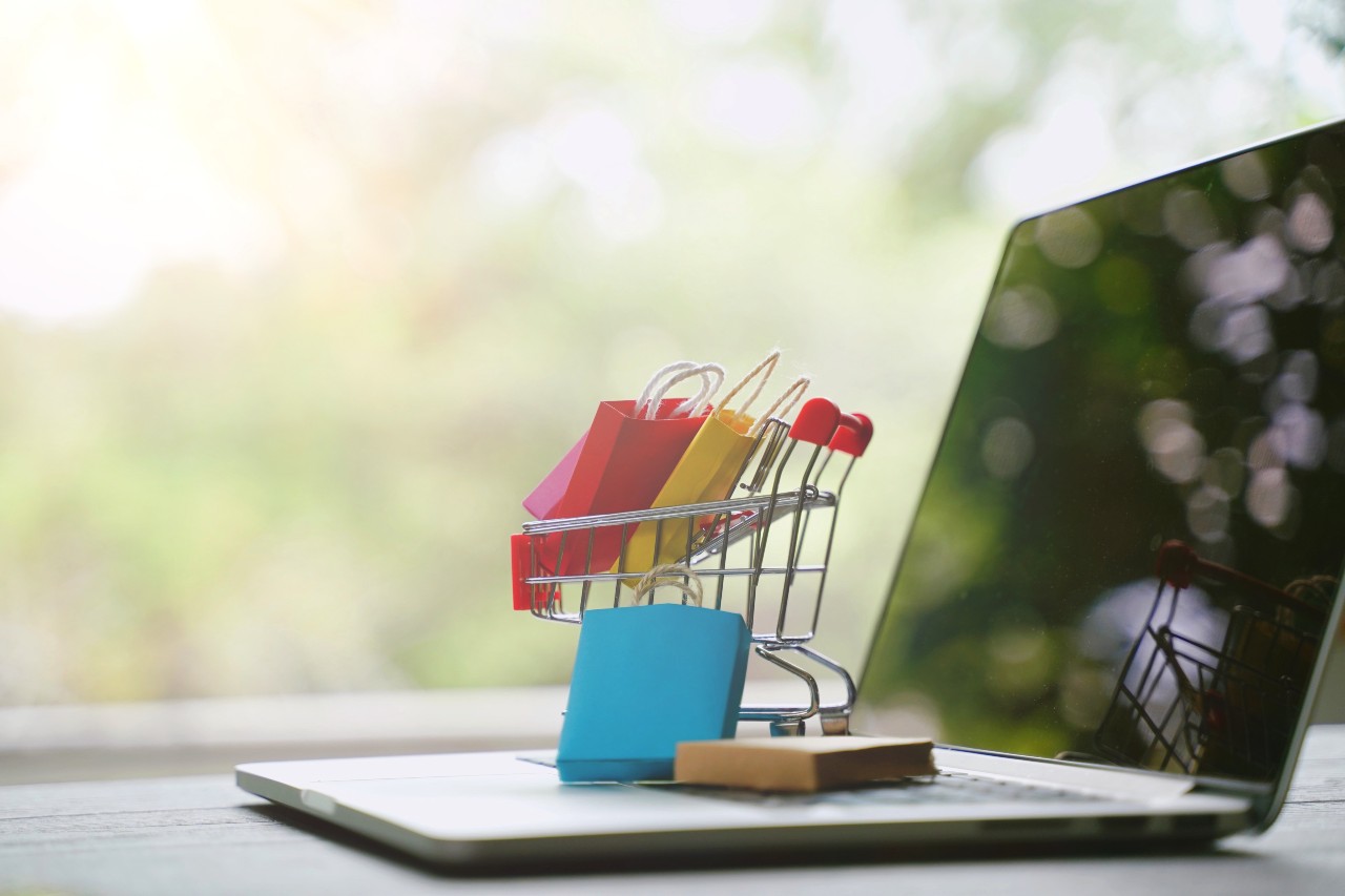image of shopping cart and laptop